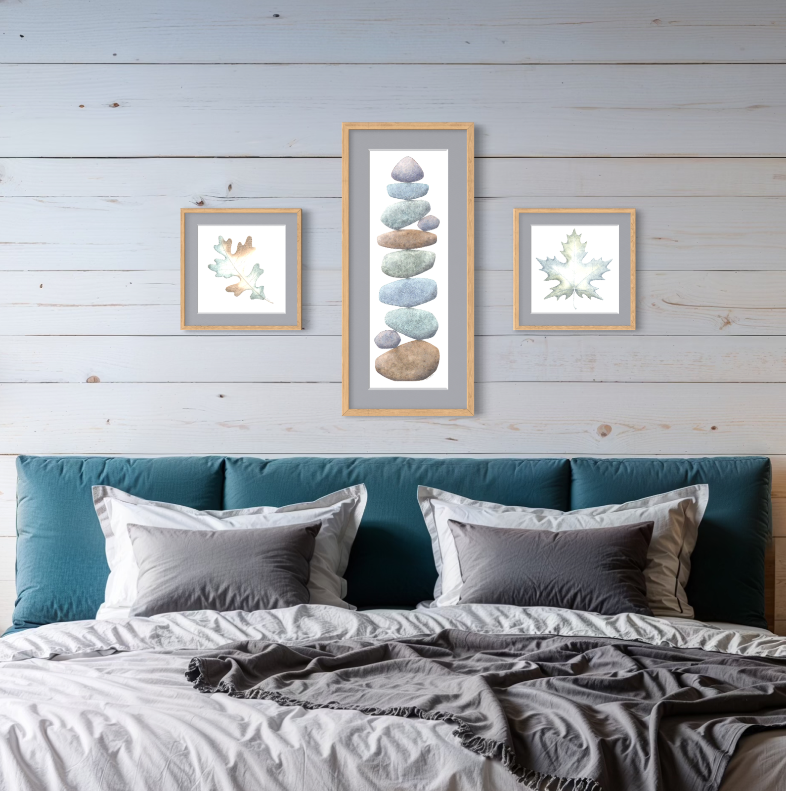 Bedroom with teal headboard, gray bedding, and framed artwork of watercolor leaves on a wooden wall.